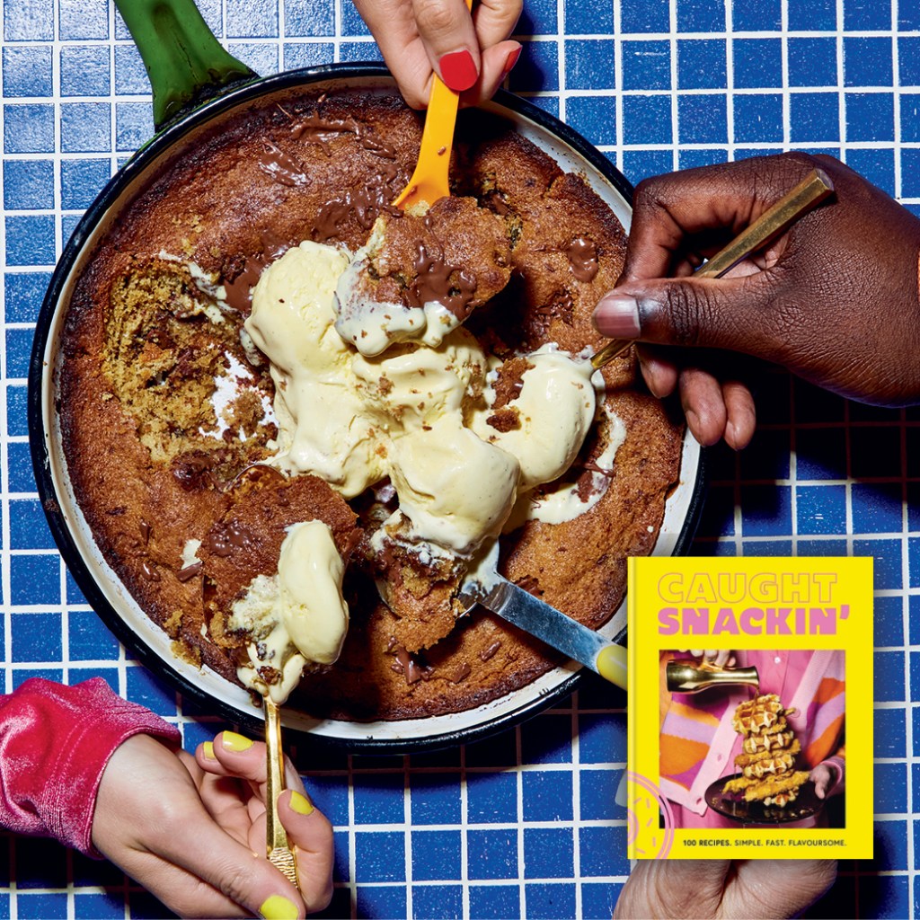 Four hands take a spoonful of giant cookie